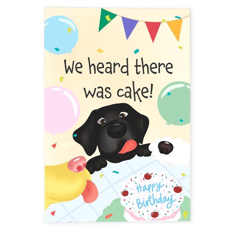 A playful birthday card cover featuring excited dogs peeking over a table with a cake, balloons, and festive bunting. The text reads, "We heard there was cake!" adding a fun and lighthearted touch.