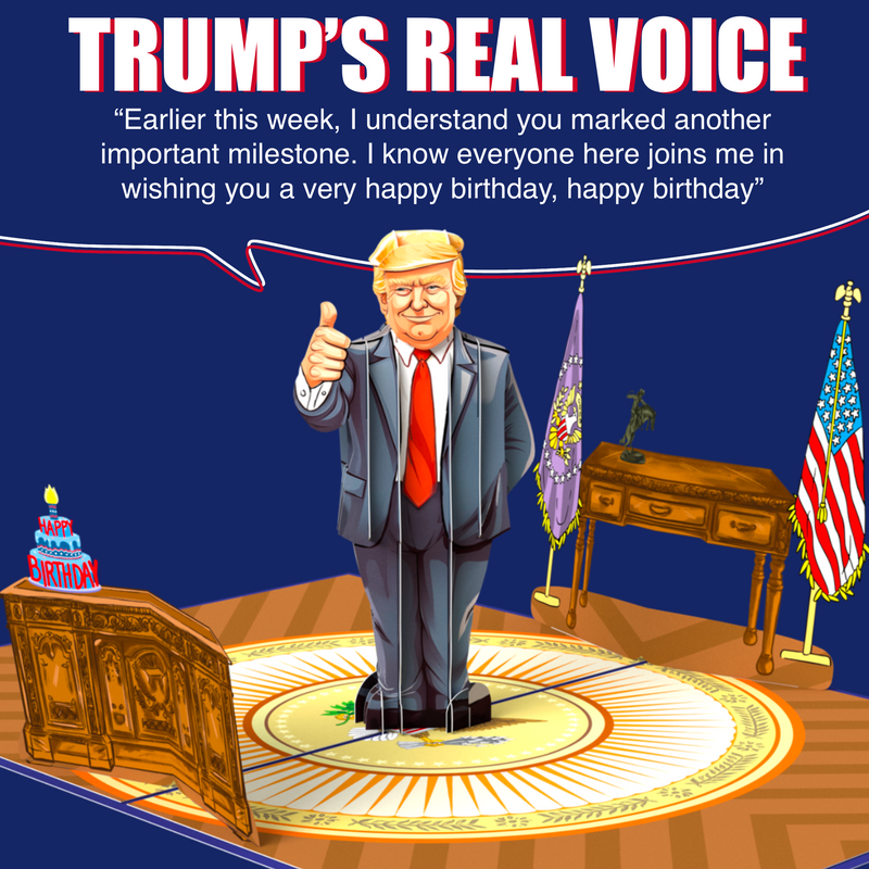 A pop-up greeting card featuring a cartoon figure resembling Donald Trump giving a thumbs-up in the Oval Office with the text Trump's Real Voice above. Below is a quote: Earlier this week, I understand you marked another important milestone...