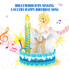 A 3D pop-up greeting card featuring a glamorous blonde woman in a white dress, reminiscent of an iconic Hollywood figure, posing playfully atop a decorated birthday cake with blue and white frosting. A large striped candle glows beside her, while golden starburst decorations and musical notes fill the background. The text above reads, 'HOLLYWOOD ICON SINGING A SULTRY HAPPY BIRTHDAY SONG,' emphasizing the card's musical feature.