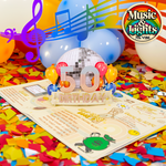 A colorful 50th birthday card with a pop-up disco ball, surrounded by balloons and confetti, featuring the text Music & Lights 70s Vibe  and music notes, celebrating a retro-themed milestone.