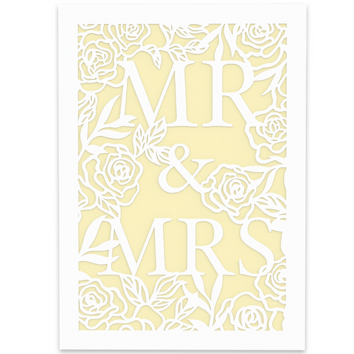 A wedding-themed greeting card featuring an intricate laser-cut design. The words 'MR & MRS' are prominently displayed in bold, elegant lettering, surrounded by delicate roses and leaves. The cut-out design is in white, revealing a soft pastel yellow background for contrast.